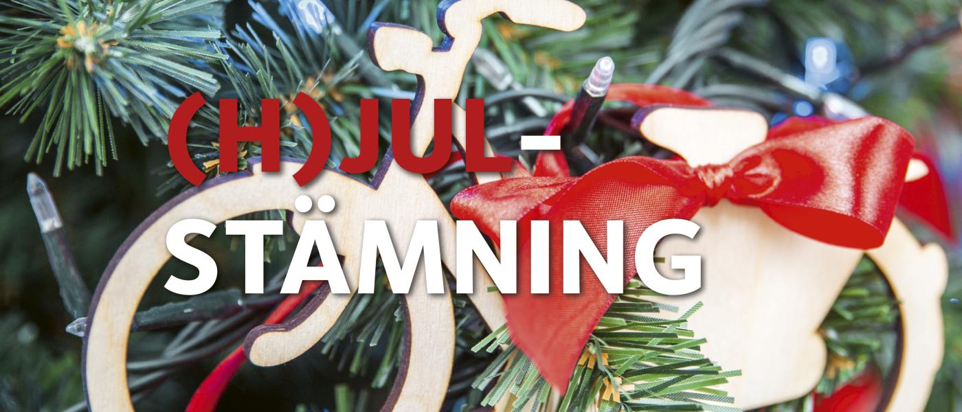 Cykel med rosett i julgran och texten (h)julstämning.