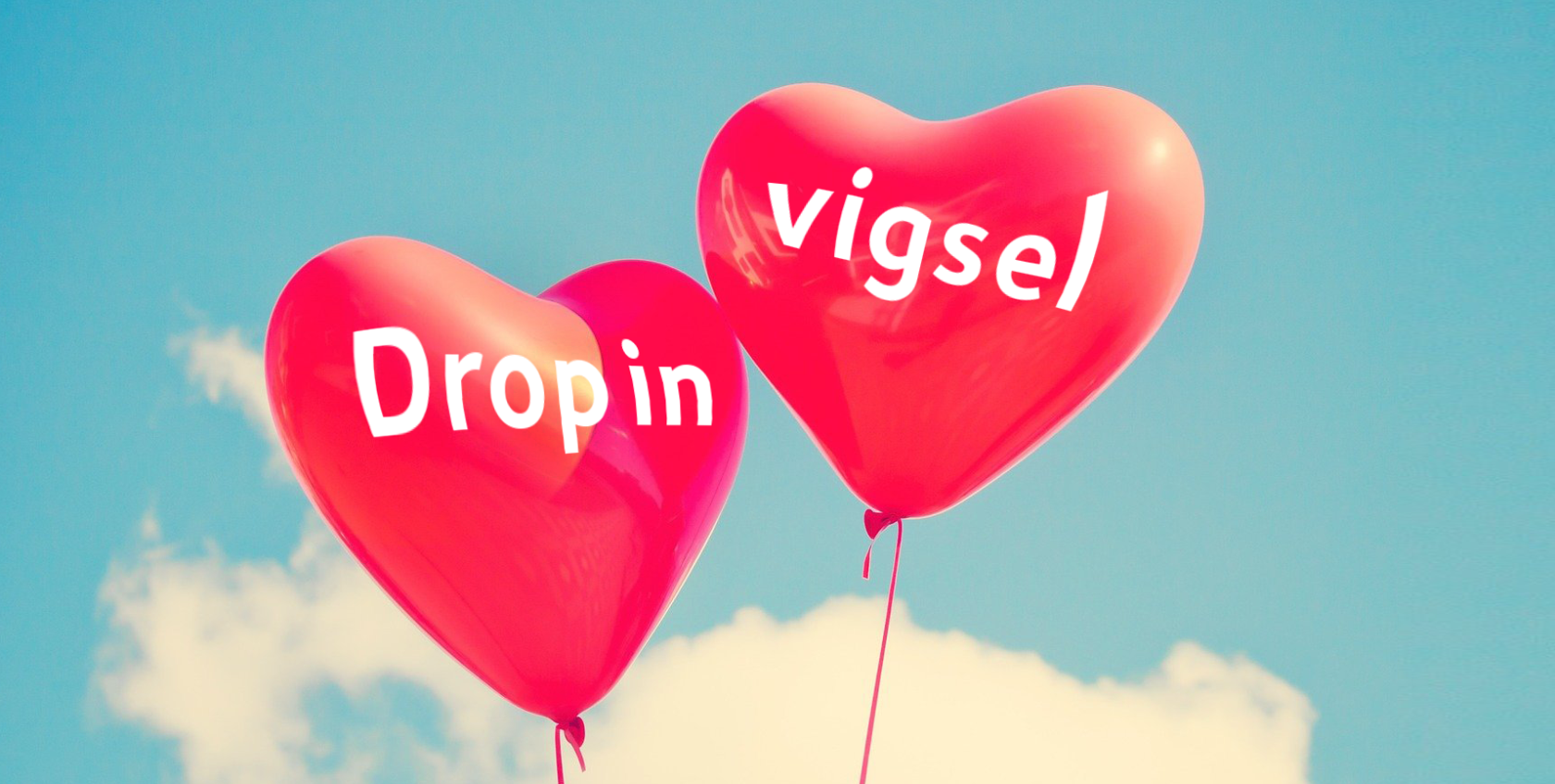 Två hjärtformade ballonger med texten Drop in Vigsel