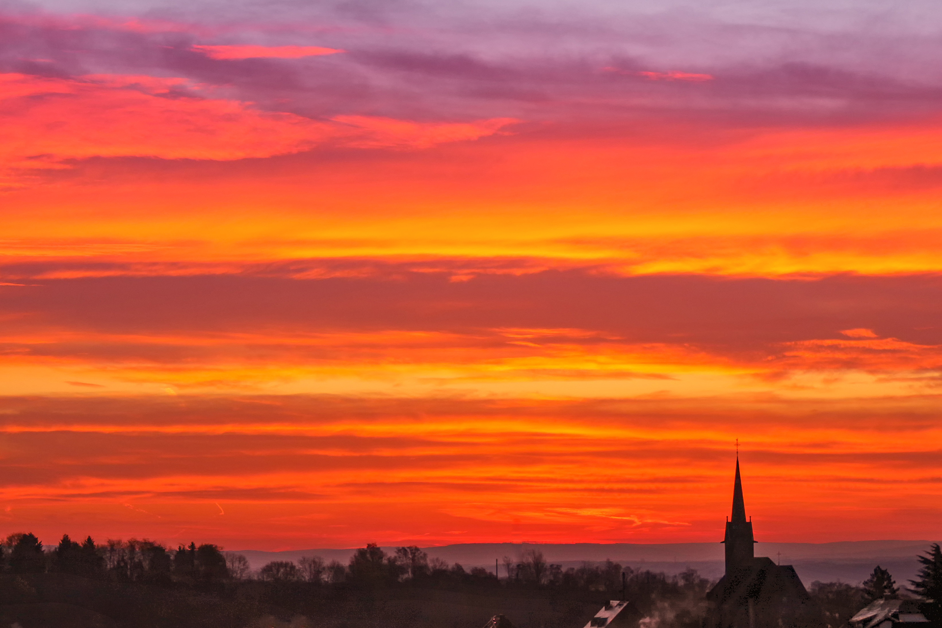 Solnedgång över kyrktorn